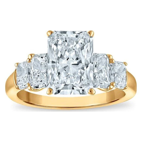 Graduated Radiant Engagement Ring in yellow gold